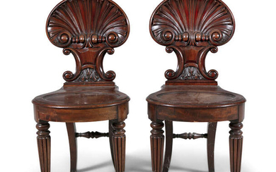 A PAIR OF REGENCY CARVED MAHOGANY HALL CHAIRS,...