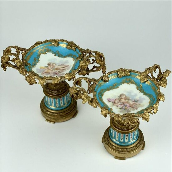 A PAIR OF DORE BRONZE MOUNTED SEVRES TAZZAS