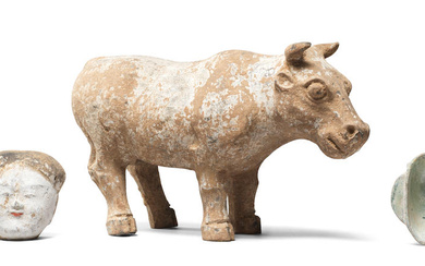 A POTTERY MODEL OF AN OX, A PAINTED POTTERY HEAD...