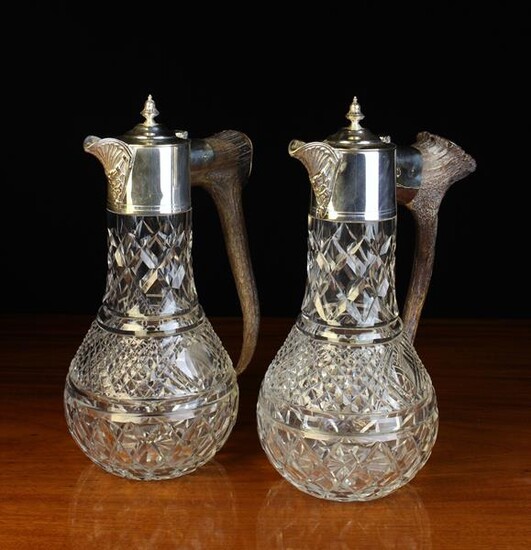 A Pair of Cut Glass Claret Jugs with...