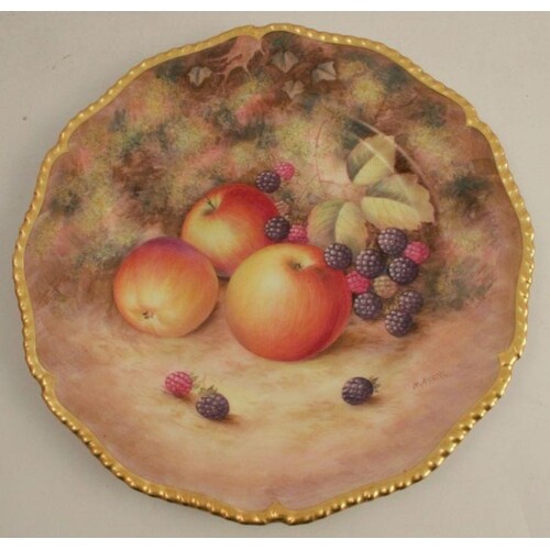 A Royal Worcester plate, with a gadroon border decorated wit...