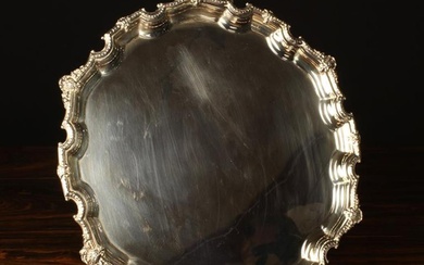 A Silver Salver by A Chick & Sons Ltd with London Hallmarks for 1965, 12½'' (32 cm) in diameter.