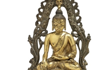 A Tibetan gilt bronze figure of Akshobhya. 16th-17th century. Weight 755 g. H. 16.5 cm.