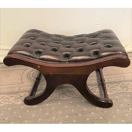 A VERY FINE BROWN LEATHER FOOTSTOOL, on mahogany x frame wit...