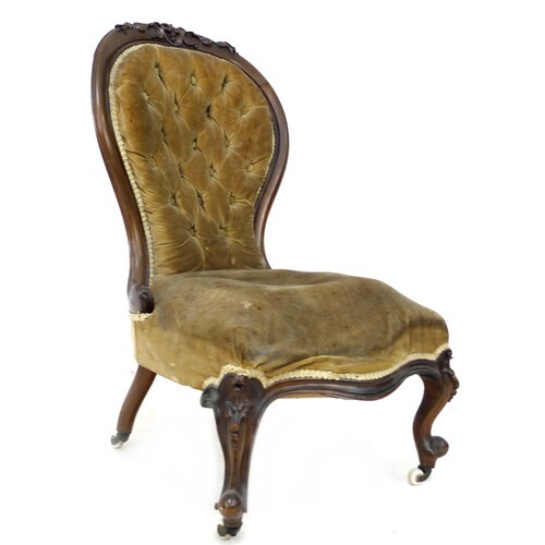 A Victorian button back nursing chair, with walnut carved t...