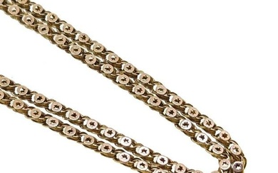A Victorian guard chain, textured twisted links with applied circular discs and pierced stars