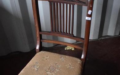 A Victorian mahogany nursing chair having turned frame