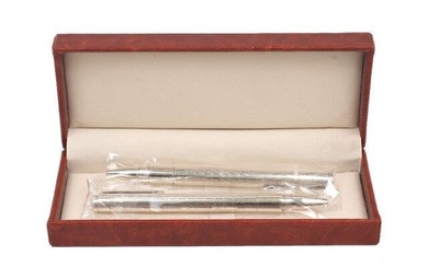 A cased pair of silver ballpoint pens, London, 2014, SJ, designed with engine turned pattern to barrels, 13.5cm long