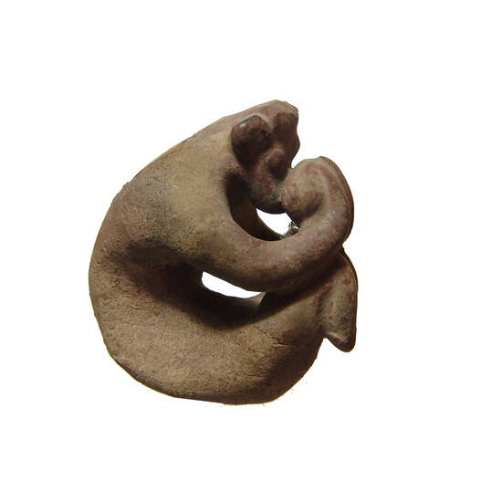 A ceramic figure of a stylized bull