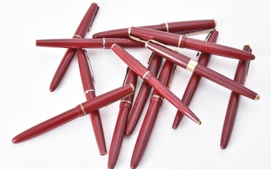 A collection of red Parker pens