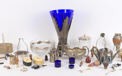A collection of silver plated items including a large leaf mounted blue glass vase