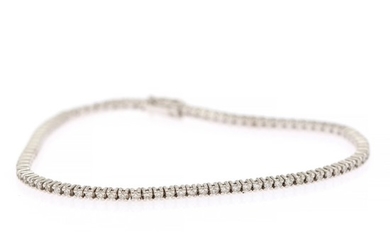 A diamond bracelet set with numerous brilliant-cut diamonds, totalling app. 1.20 ct., mounted in 18k white gold. W. 2 mm. L. 17.5 cm.