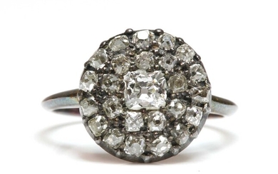 A diamond set circular cluster ring