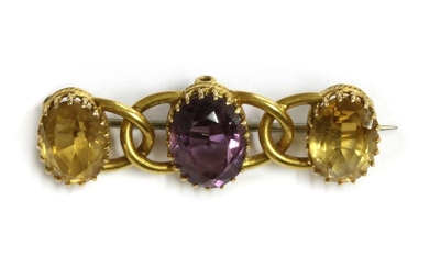 A gold amethyst and citrine brooch