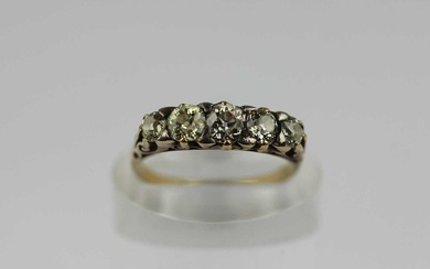 A gold and silver set diamond five stone ring