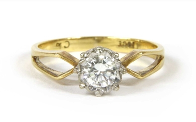 A gold single stone diamond ring