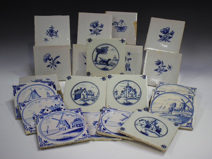 A group of approximately sixty Dutch Delft blue and white tiles, late 19th/early 20th century, inclu