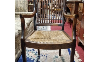 A late 19th early 20th Century flatback Armchair with rush s...