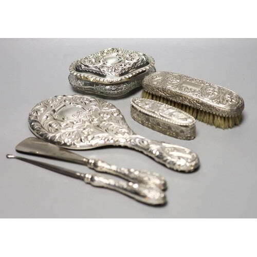 A late Victorian repousse silver mounted hand mirror, London...