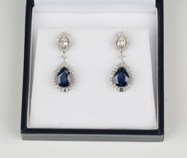 A pair of 18ct white gold, sapphire and diamond pendant earrings, each drop claw set with a pear sha