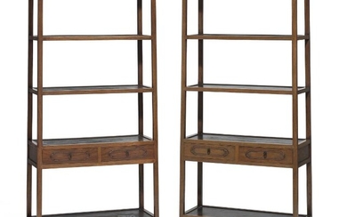 SOLD. A pair of Chinese huanghuali showcases with open shelves and each with a pair of profiled drawers. Qing dynasty, 18th-19th century. (2) – Bruun Rasmussen Auctioneers of Fine Art