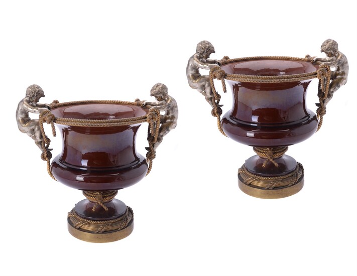 A pair of Continental gilt and silvered metal and pottery mounted jardinières