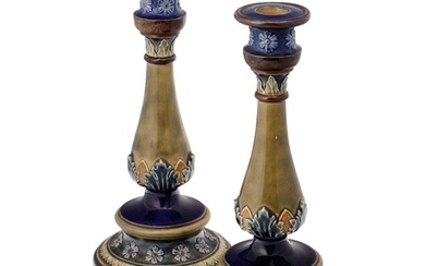 A pair of Doulton Lambeth stoneware candlesticks, baluster f...