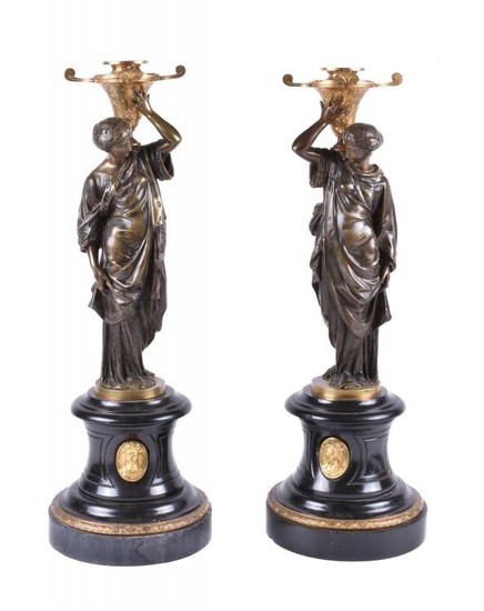 A pair of French gilt bronze and Noir Belge mounted figural candle holders in Orientalist taste, circa 1870