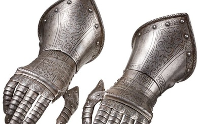 A pair of French or Italian gauntlets with etched embellishment, circa 1600