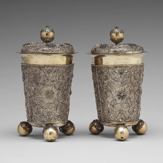 A pair of Swedish 17th century filigree and parcel-gilt silver beakers and covers, mark Rudolf Wittkopf, Stockholm 1698.