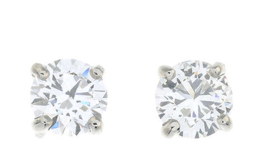 A pair of brilliant-cut diamond single-stone earrings.