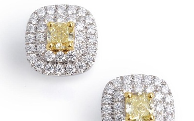 A pair of diamond ear studs each set with a cushion-cut fancy yellow diamond weighing a total of app. 0.62 ct. encircled by numerous brilliant-cut diamonds weighing a total of app. 0.62 ct., mounted in 18k gold and white gold. Colour: River (D)...
