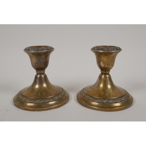 A pair of dwarf sterling silver candlesticks by Gorham Silve...