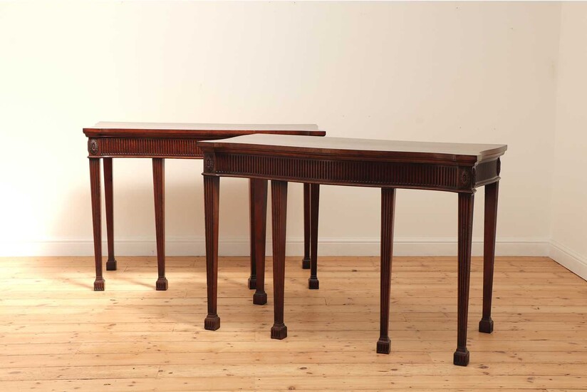 A pair of mahogany console tables