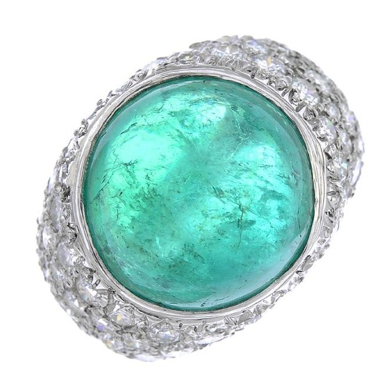A platinum Colombian emerald and diamond ring. Of bombe