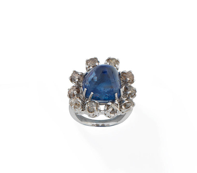 A sapphire and coloured diamond dress ring