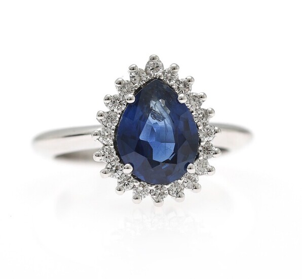 NOT SOLD. A sapphire and diamond ring set with a pear-shaped sapphire encircled by diamonds,...