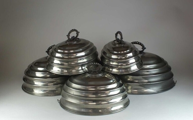 A set of five graduated silver plated meat covers