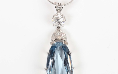 A synthetic blue spinel and diamond pendant, claw set with the large oval cut synthetic blue spinel