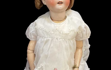 A vintage Heubach German bisque porcelain headed doll, in white...