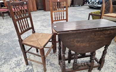 AN OAK OVAL FLAP TOP OCCASIONAL TABLE TOGETHER WITH TWO RUSH SEATED CHAIRS