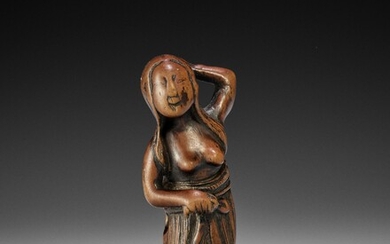 AN OLD WOOD NETSUKE OF A DIVING GIRL (AMA)
