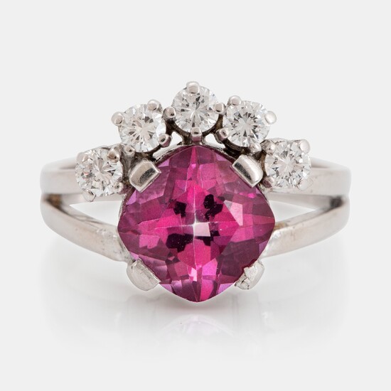An 18K white gold ring set with a pink topaz and round brilliant-cut diamonds