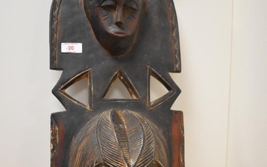 An African carved wooden totem mask.