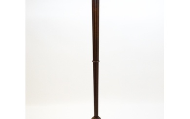 An Art Deco style oak standard lamp with a chamfered stem an...