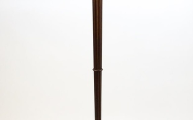 An Art Deco style oak standard lamp with a chamfered stem and a moulded hexagonal base. Approx. 56"