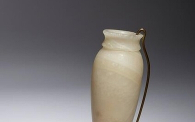 An Egyptian Alabaster Vessel Height 5 3/8 inches.