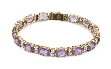 An amethyst and diamond bracelet, set with oval cut amethysts...
