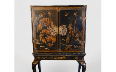 An early 18th century Chinese export black lacquer cabinet o...