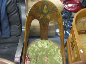 An early 19th century painted spoon back low chair decorated...